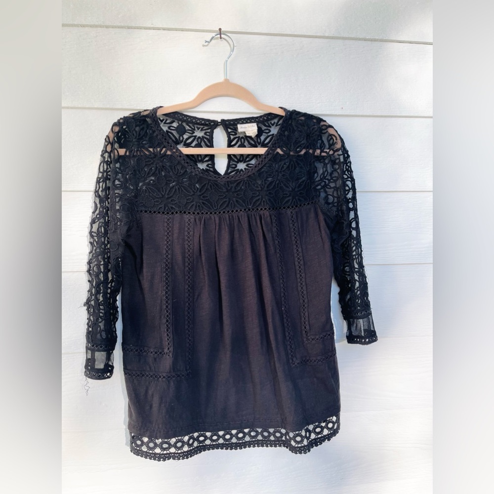 Anthropologie black top with lace detailing. Size small.